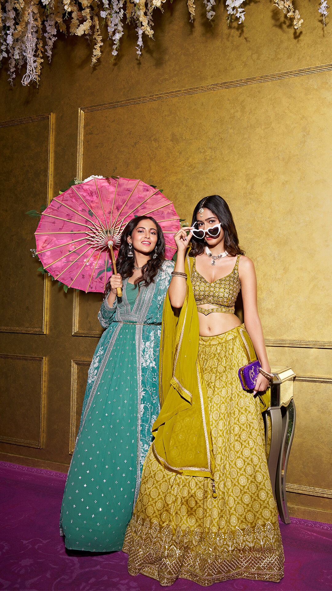 A bride and bridesmade wearing green and yellow lehenga 